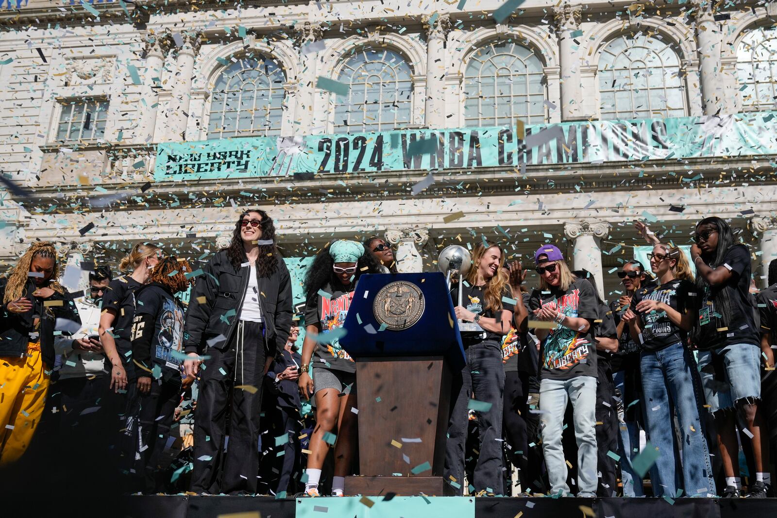 The New York Liberty, their supporters, local officials and others celebrate during a ceremony after a parade in honor of the Liberty's WNBA basketball championship at City Hall in New York, Thursday, Oct. 24, 2024. (AP Photo/Seth Wenig)