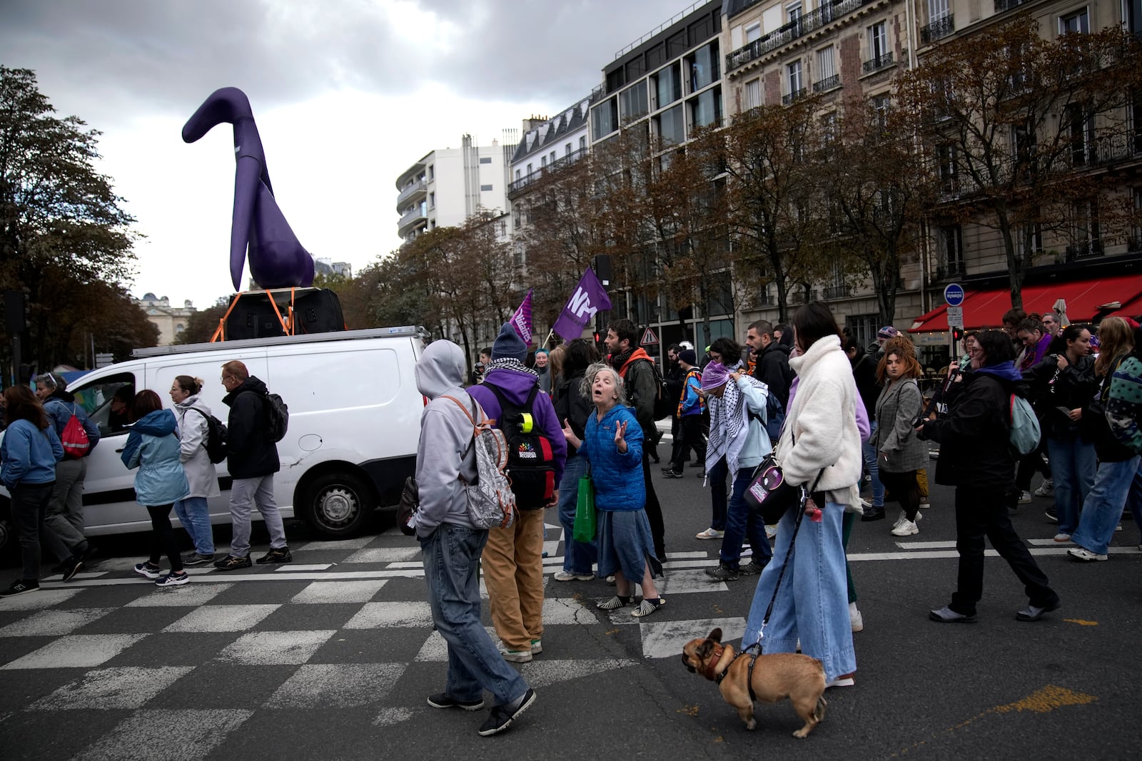 Demonstrators attend a march in support of the right to abortion for women across the world, in Paris, Saturday, Sept. 28, 2024. (AP Photo/Christophe Ena)