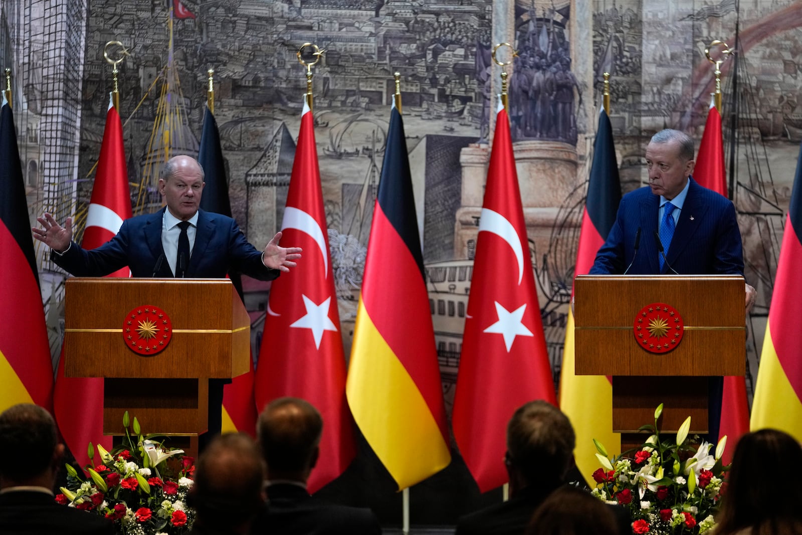 Turkey's President Recep Tayyip Erdogan, right, and Germany's Chancellor Olaf Scholz, answer journalists questions hold a presser in Istanbul, Turkey, Saturday, Oct. 19, 2024. (AP Photo/Khalil Hamra)