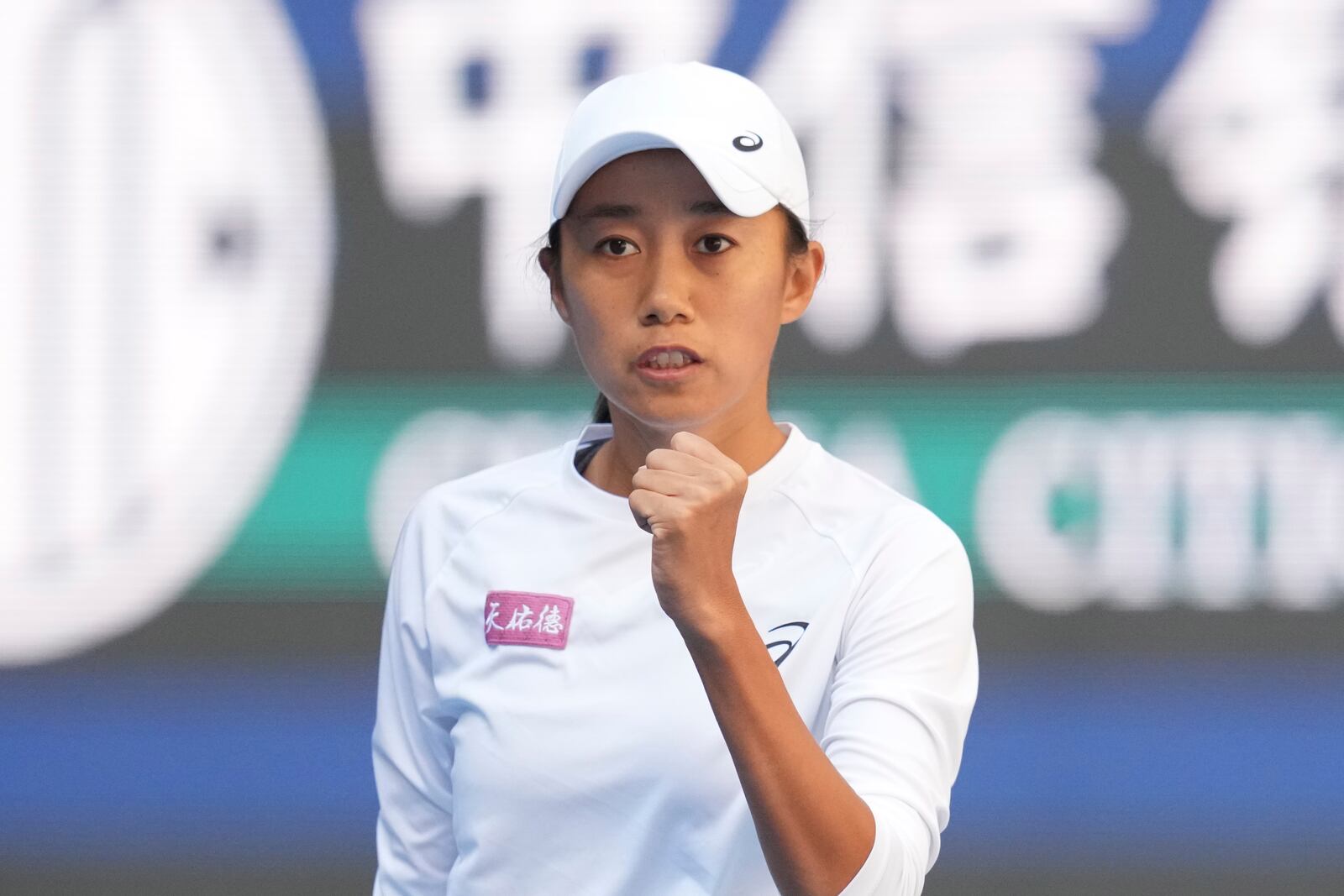 Zhang Shuai of China celebrates after winning a point against Magdalena Frech of Poland in women's singles match for the China Open tennis tournament at the national tennis center in Beijing, Tuesday, Oct. 1, 2024. (AP Photo/Achmad Ibrahim)