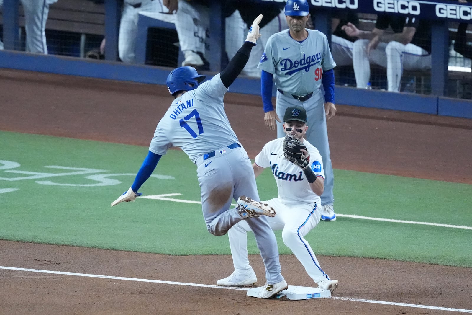 Los Angeles Dodgers' Shohei Ohtani (17) of Japan, steals third base as Miami Marlins third baseman Connor Norby attempts the tag during the first inning of a baseball game, Thursday, Sept. 19, 2024, in Miami. (AP Photo/Wilfredo Lee)