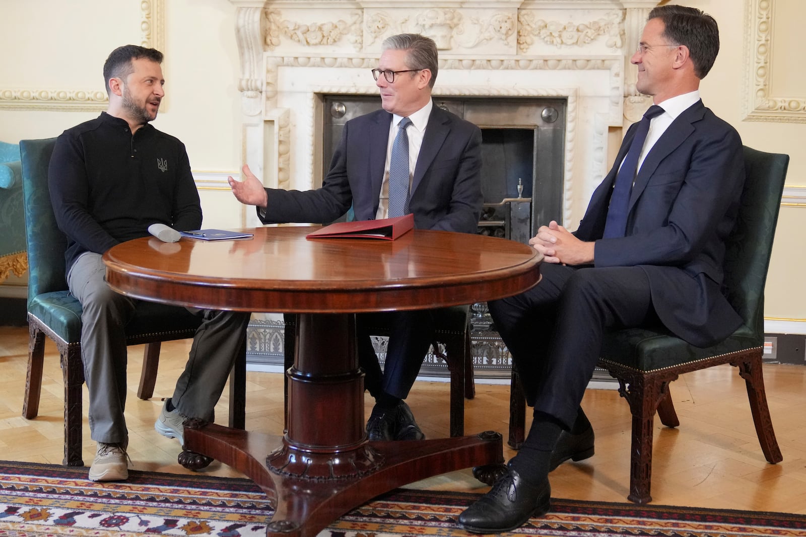 Britain's Prime Minister Keir Starmer, center, NATO Secretary General Mark Rutte, right, and Ukrainian President Volodymyr Zelenskyy meet inside 10 Downing Street in London, Thursday, Oct. 10, 2024.(AP Photo/Kin Cheung, Pool)