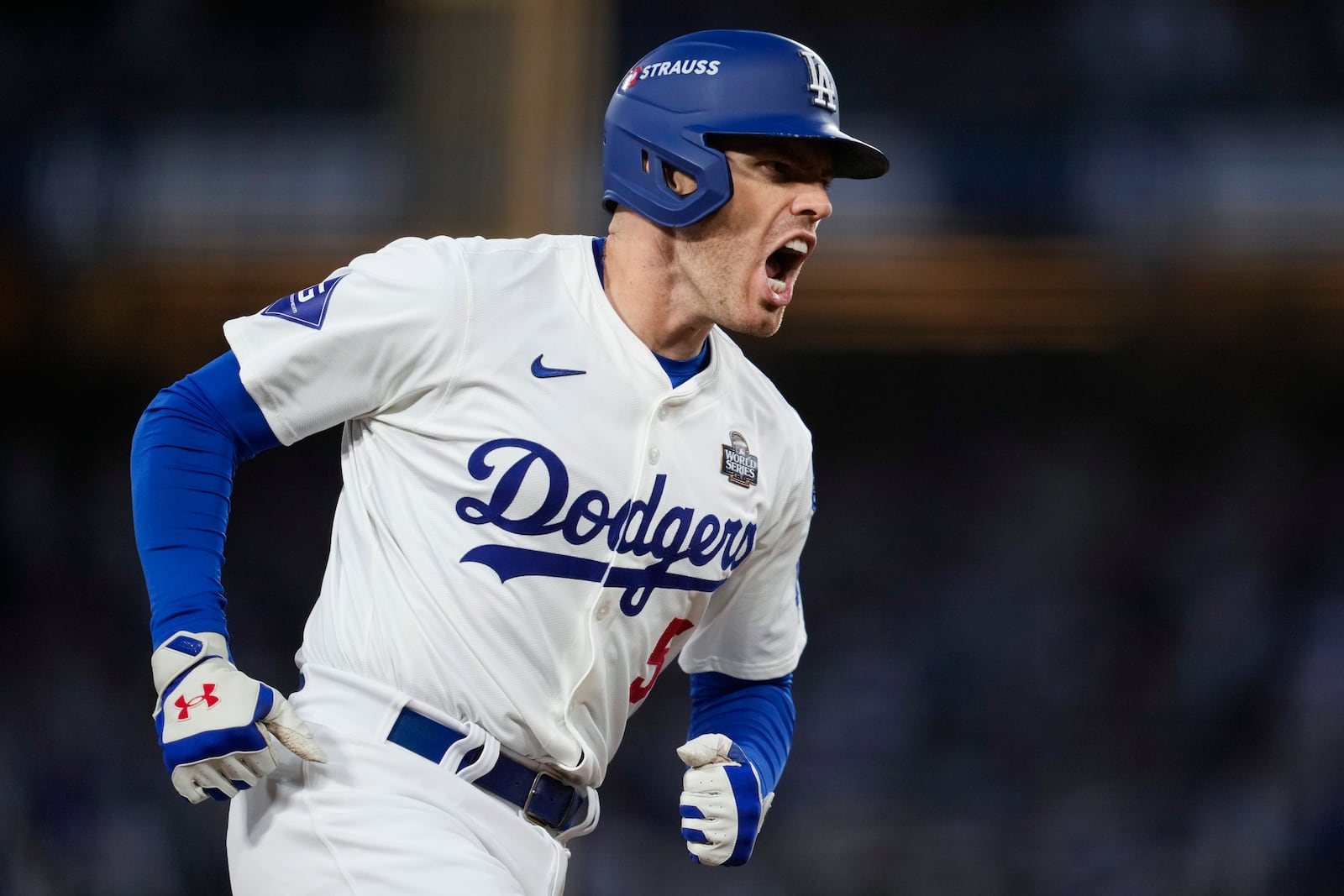 Los Angeles Dodgers' Freddie Freeman celebrates his home run against the New York Yankees during the third inning in Game 2 of the baseball World Series, Saturday, Oct. 26, 2024, in Los Angeles. (AP Photo/Ashley Landis)