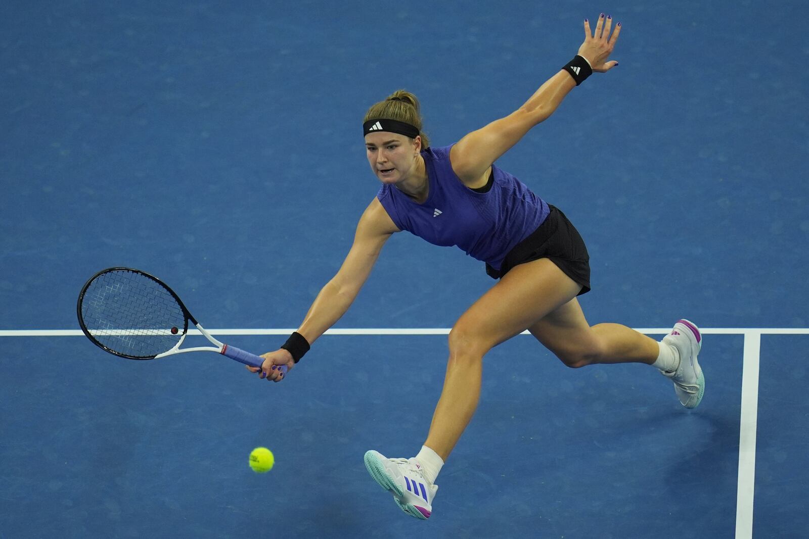 Karolina Muchova of Czech Republic returns a shot to Coco Gauff of the United States during the women's singles final match at the China Open tennis tournament at the National Tennis Center in Beijing, Sunday, Oct. 6, 2024. (AP Photo/Ng Han Guan)