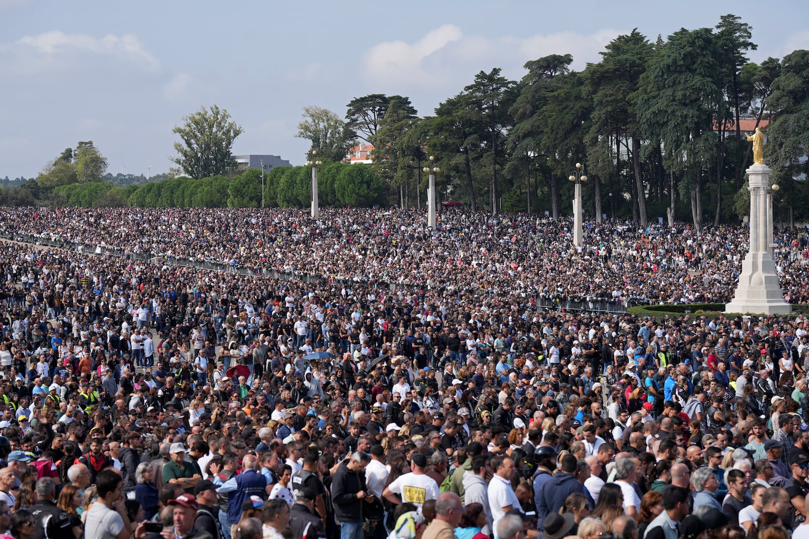 Tens of thousands, 180.000 according to the organization, gather at the Roman Catholic holy shrine of Fatima during the IX Pilgrimage of the Blessing of Helmets, in Fatima, Portugal, Sunday, Sept. 22, 2024. (AP Photo/Ana Brigida)