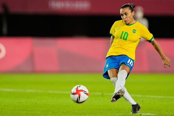 FILE - Brazil's Marta takes a penalty shot during a shootout in a women's quarterfinal soccer match against Canada at the 2020 Summer Olympics, Friday, July 30, 2021, in Rifu, Japan. (AP Photo/Andre Penner, File)
