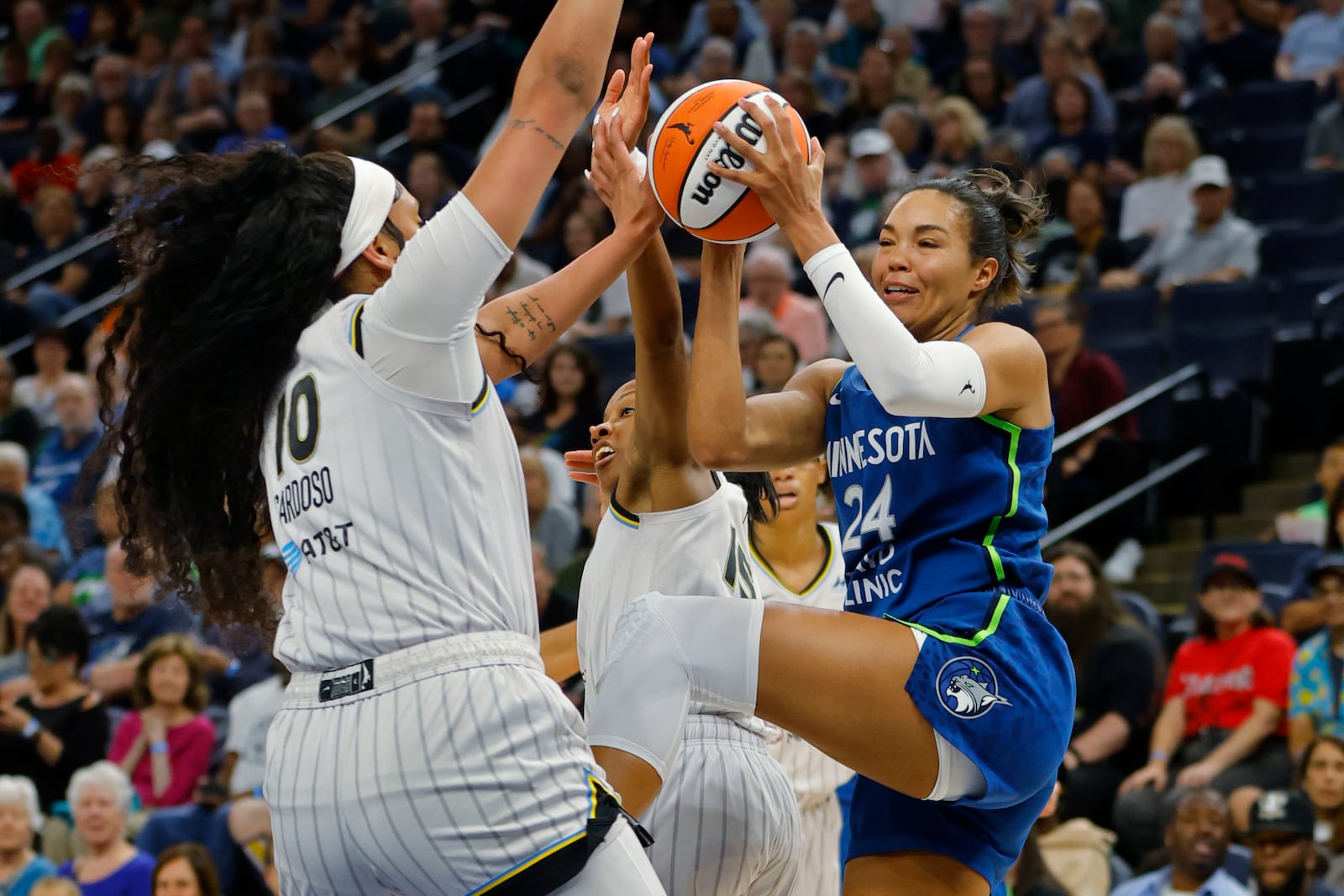 Minnesota Lynx forward Napheesa Collier (24) goes up against Chicago Sky center Kamilla Cardoso (10) in the first quarter of a WNBA basketball game Friday, Sept. 13, 2024, in Minneapolis. (AP Photo/Bruce Kluckhohn)