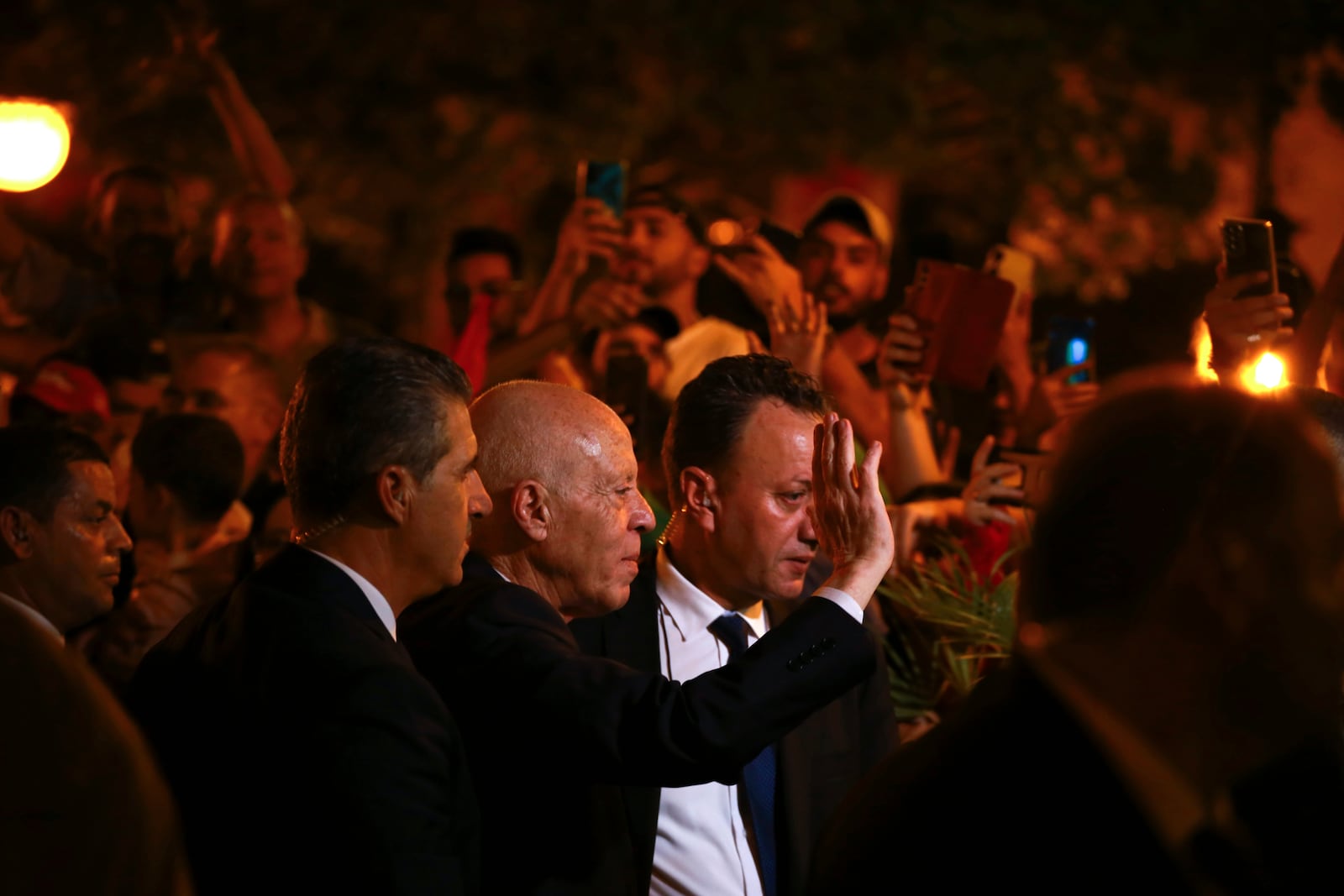 Tunisian president and candidate for re-election Kais Saied joins his supporters after the announcement of the provisional results for the presidential elections, in the capital Tunis, Tunisia, Sunday, Oct. 6, 2024. (AP Photo/Anis Mili)