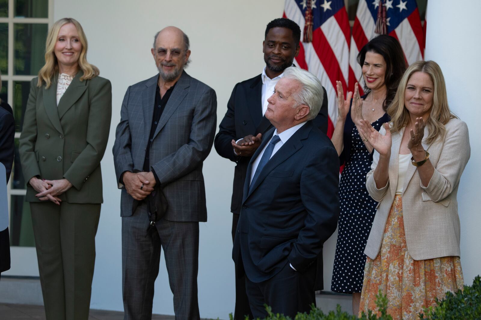 Actor Martin Sheen and other members of the cast of The West Wing, listen to Aaron Sorkin speak at an event on the Rose Garden at the White House to mark the 25th anniversary of the television series, The West Wing, Friday, Sept. 20, 2024, in Washington. (AP Photo/Manuel Balce Ceneta)