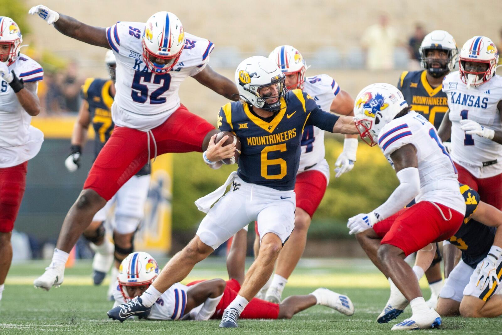 West Virginia's Garrett Greene (6) rushes downfield with the ball against Kansas during an NCAA college football game Saturday, Sept. 21, 2024, in Morgantown, W.Va. (Benjamin Powell/The Dominion-Post via AP)