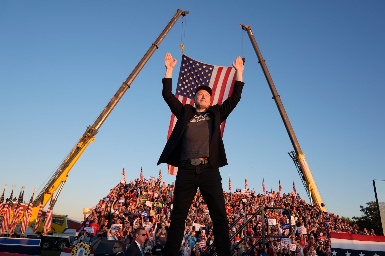 Tesla and SpaceX CEO Elon Musk walks to the stage to speak alongside Republican presidential nominee former President Donald Trump at a campaign event at the Butler Farm Show, Saturday, Oct. 5, 2024, in Butler, Pa. (AP Photo/Alex Brandon)