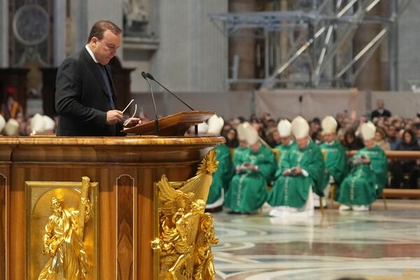 Abel Eduardo Balbo, former soccer player from Argentina, reads during a mass presided by Pope Francis on the occasion of the World Day of the Poor in St. Peter's Basilica, at the Vatican, Sunday, Nov. 17, 2024. (AP Photo/Alessandra Tarantino)