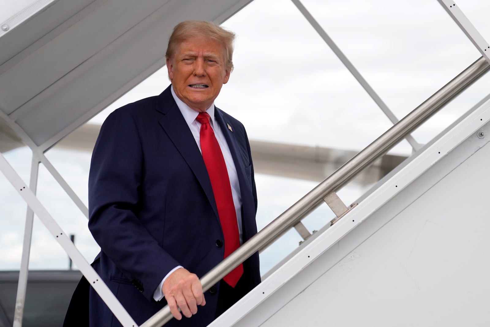 Republican presidential nominee former President Donald Trump boards his plane at West Palm Beach International Airport, Saturday, Oct. 5, 2024, in West Palm Beach, Fla., as he travels to a campaign rally in Butler, Pa. (AP Photo/Evan Vucci)