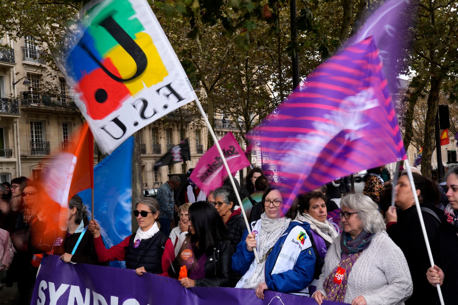 Demonstrators attend a march in support of the right to abortion for women across the world, in Paris, Saturday, Sept. 28, 2024. (AP Photo/Christophe Ena)