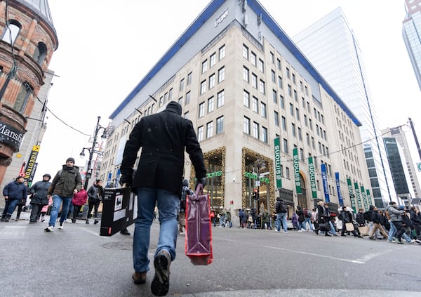 Shoppers take advantage of Black Friday deals in Montreal on Friday, Nov. 29, 2024. (Christinne Muschi /The Canadian Press via AP)