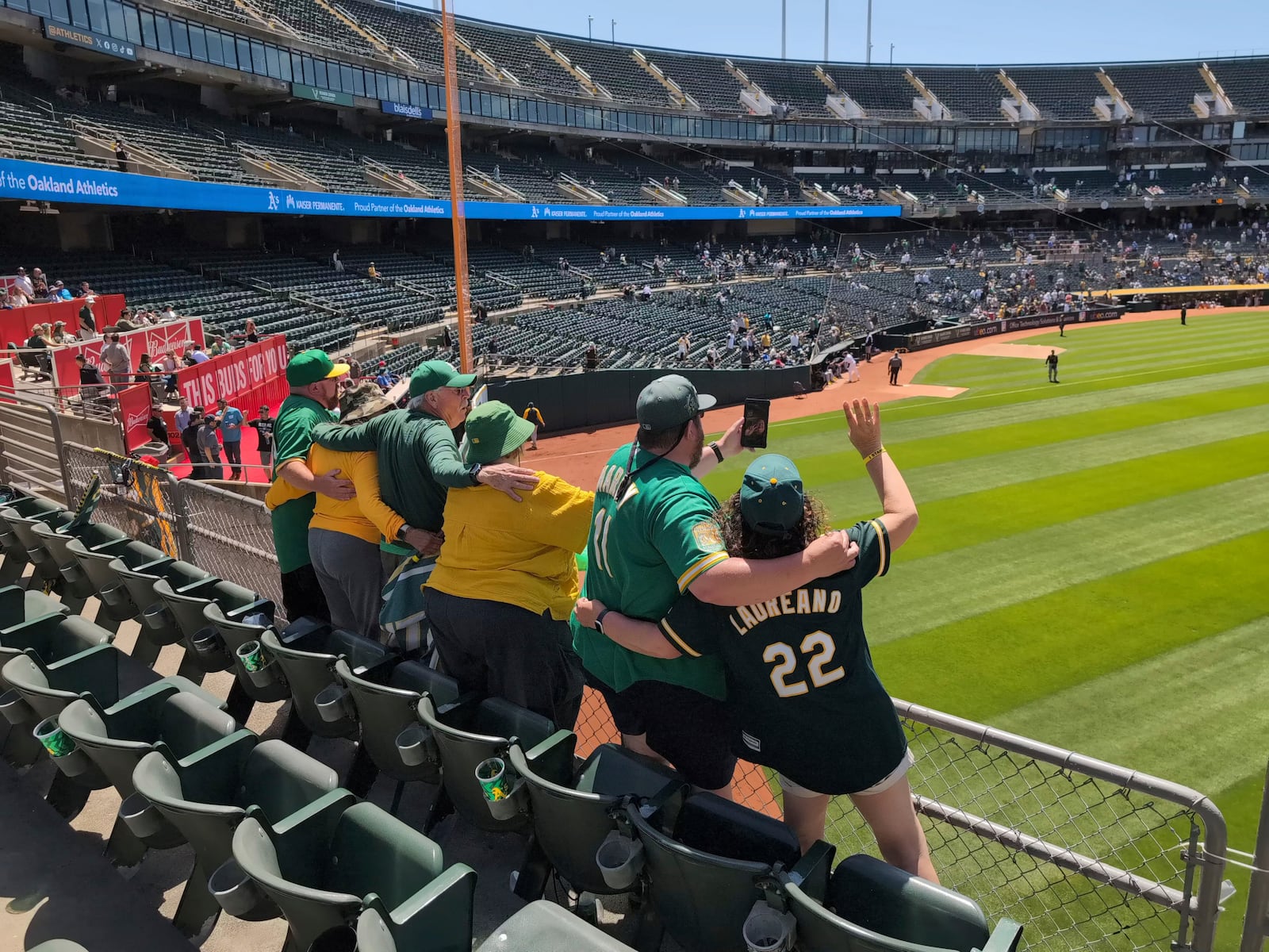 "Right-Field" Will MacNeil and several other A's fans sing "Take Me Out To The Ballgame" in the Oakland Coliseum during the seventh-inning stretch of a game against the Pittsburgh Pirates on May 1, 2024, in Oakland, Calif. (AP Photo/Michael Liedtke)