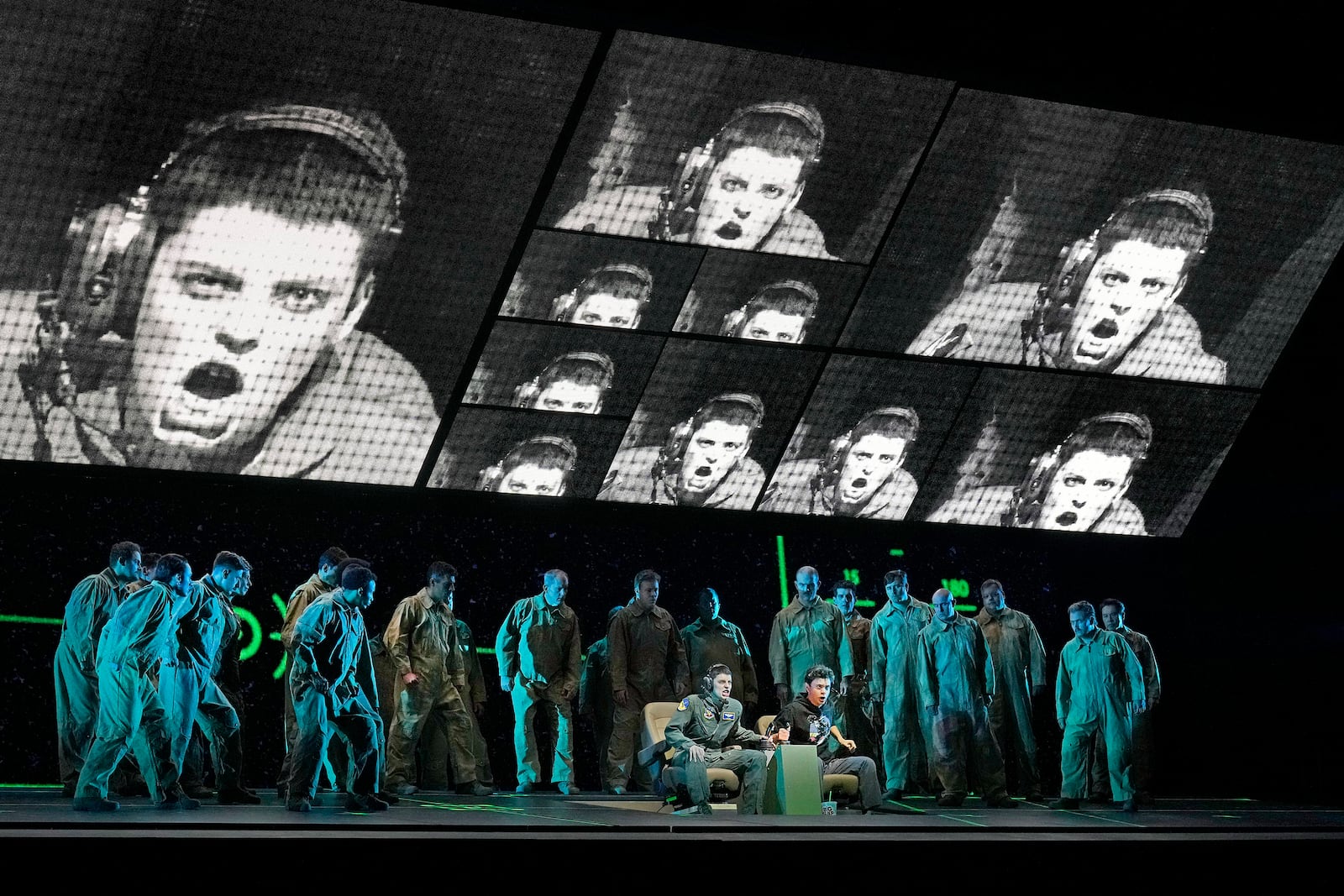 This image released by the Metropolitan Opera shows Emily D'Angelo as Jess, seated left, and and Kyle Miller as the Sensor, seated right, during a performance of Jeanine Tesori's "Grounded" in New York on Sept. 16, 2024. (Ken Howard/Met Opera via AP)