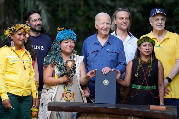 President Joe Biden poses after signing a proclamation designating Nov. 17 as International Conservation Day following a tour of the Museu da Amazonia, Sunday, Nov. 17, 2024, in Manaus, Brazil. (AP Photo/Manuel Balce Ceneta)