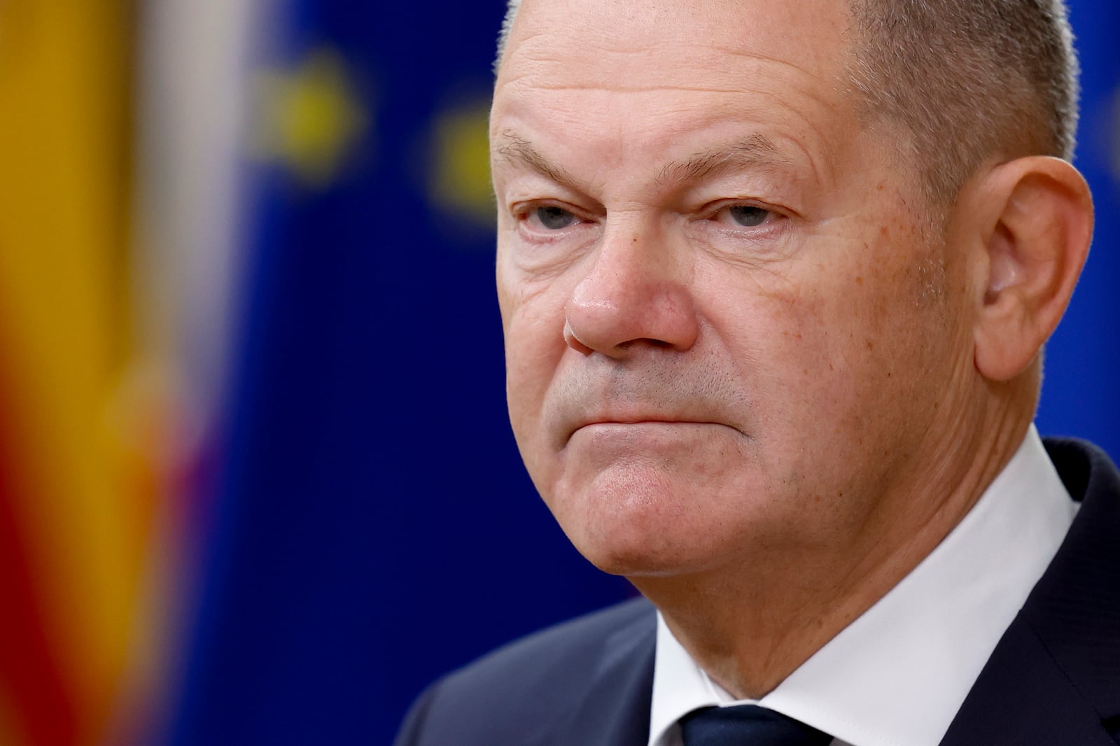 Germany's Chancellor Olaf Scholz talks to journalists as he arrives to an EU summit in Brussels, Thursday, Oct. 17, 2024. (AP Photo/Geert Vanden Wijngaert)