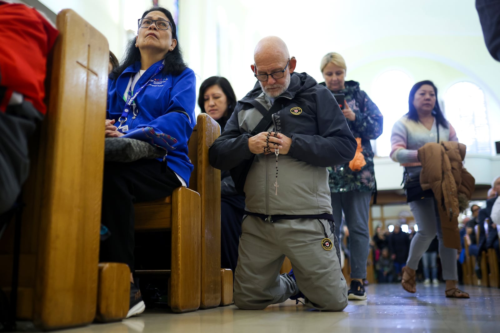 Pilgrims say their prayers inside the St. James Church in Medjugorje, Bosnia, Thursday, Sept. 19, 2024. (AP Photo/Armin Durgut)