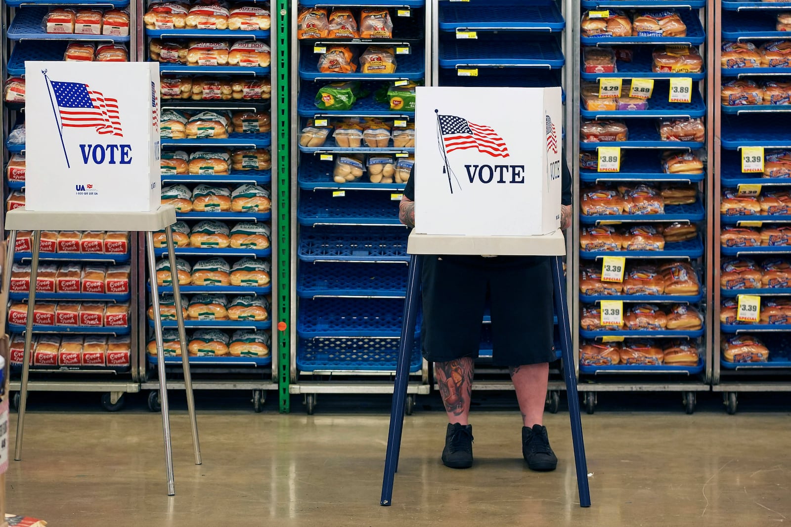 Steven Vandenburgh votes at a grocery store, Tuesday, Nov. 5, 2024, in Lawrence, Kan. (AP Photo/Charlie Riedel)