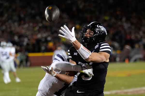 Kansas State cornerback Keenan Garber, left, breaks up a pass intended for Iowa State wide receiver Jayden Higgins during the first half of an NCAA college football game, Saturday, Nov. 30, 2024, in Ames, Iowa. (AP Photo/Charlie Neibergall)