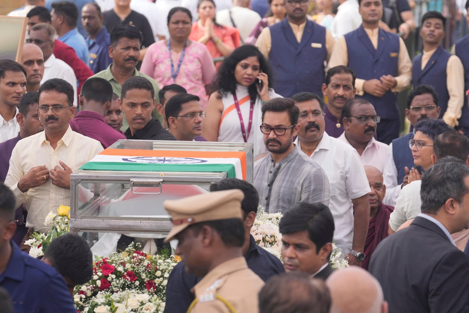 Bollywood actor Aamir Khan, center, pays tributes to Indian business leader Ratan Tata who died on Wednesday night, in Mumbai, India, Thursday, Oct. 10, 2024. (AP Photo /Rafiq Maqbool)