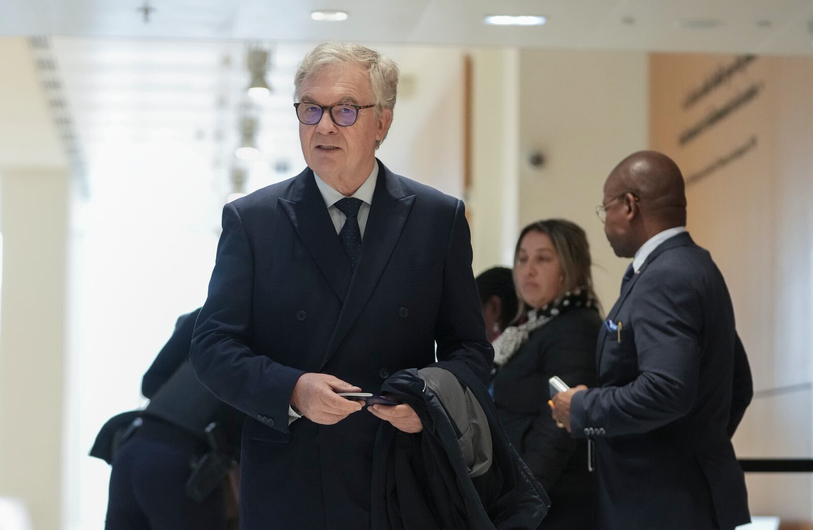 The member of the French far right party Jean-Paul Garraud, front, arrives at the court house in Paris, Monday, Sept. 30, 2024. (AP Photo/Thibault Camus)