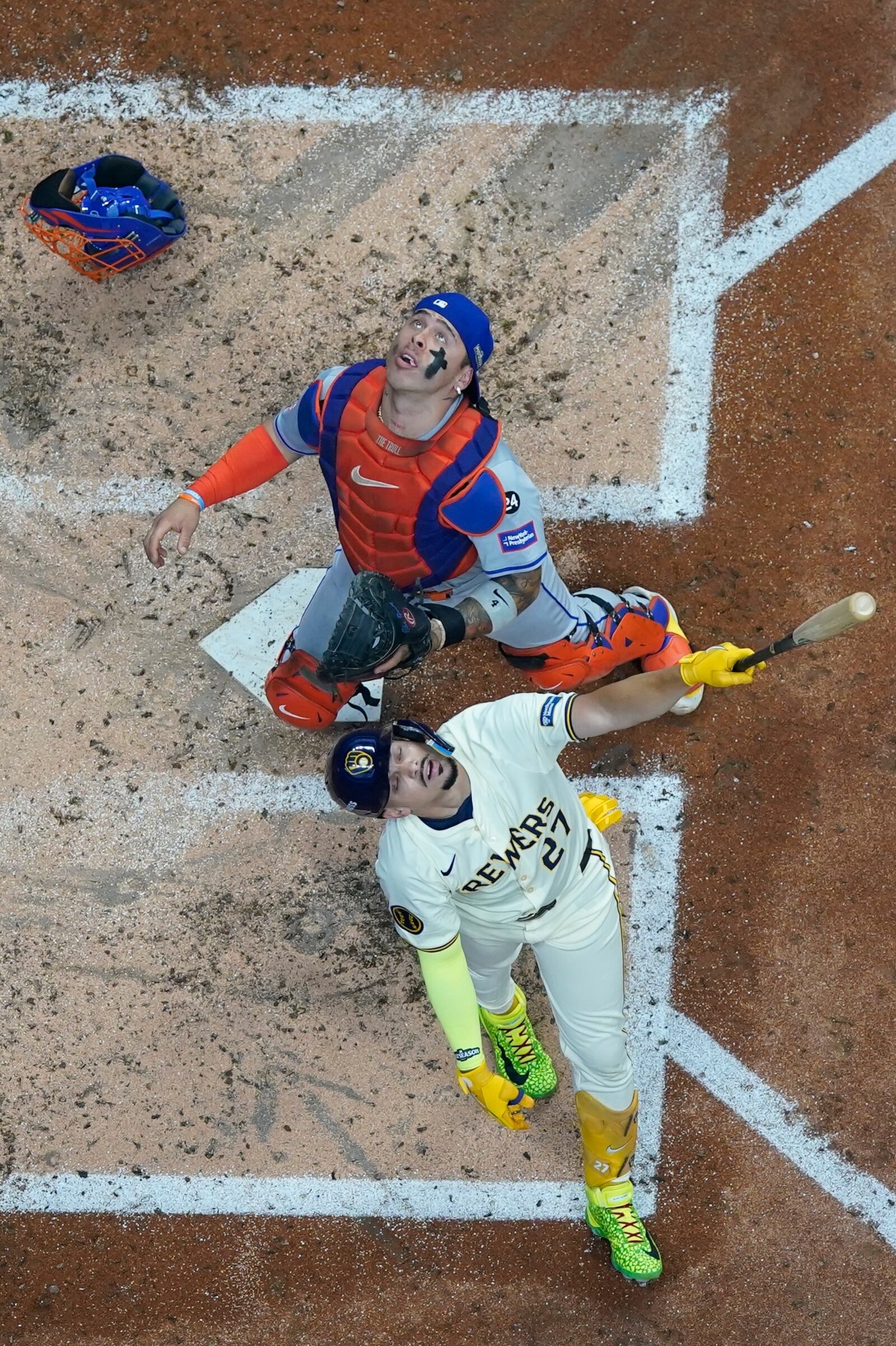 Milwaukee Brewers' Willy Adames pops out to New York Mets catcher Francisco Alvarez during the third inning of Game 2 of a National League wild card baseball game Tuesday, Oct. 1, 2024, in Milwaukee. (AP Photo/Morry Gash)