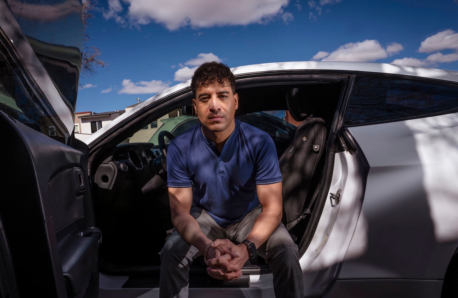 Carlos Sandoval-Smith, who detailed his encounters with an Albuquerque police officer and a law firm implicated in a DWI corruption probe, poses in Albuquerque, N.M., Thursday, Feb. 23, 2024. (Chancey Bush/The Albuquerque Journal via AP)