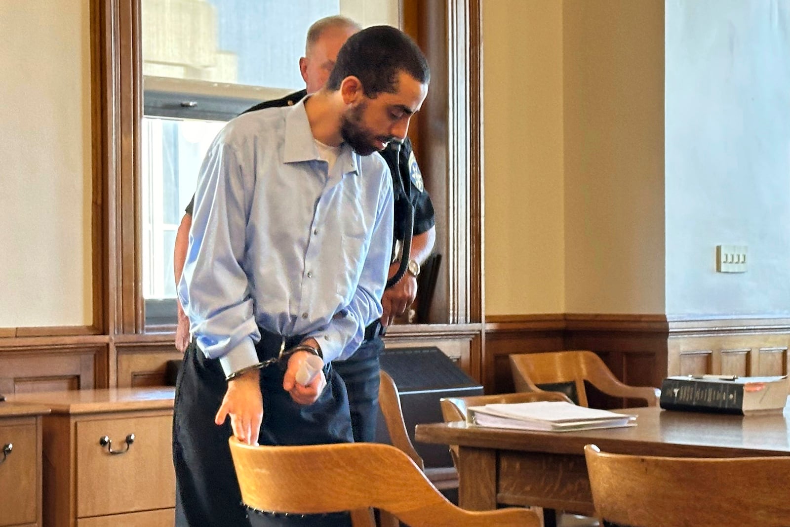 Had Matar, charged with attempted murder for stabbing author Salman Rushdie more than a dozen times, is escorted into the courtroom for a hearing in Chautauqua County Court, Friday, Oct. 4, 2024, in Mayville, N.Y. (AP Photo/Carolyn Thompson)