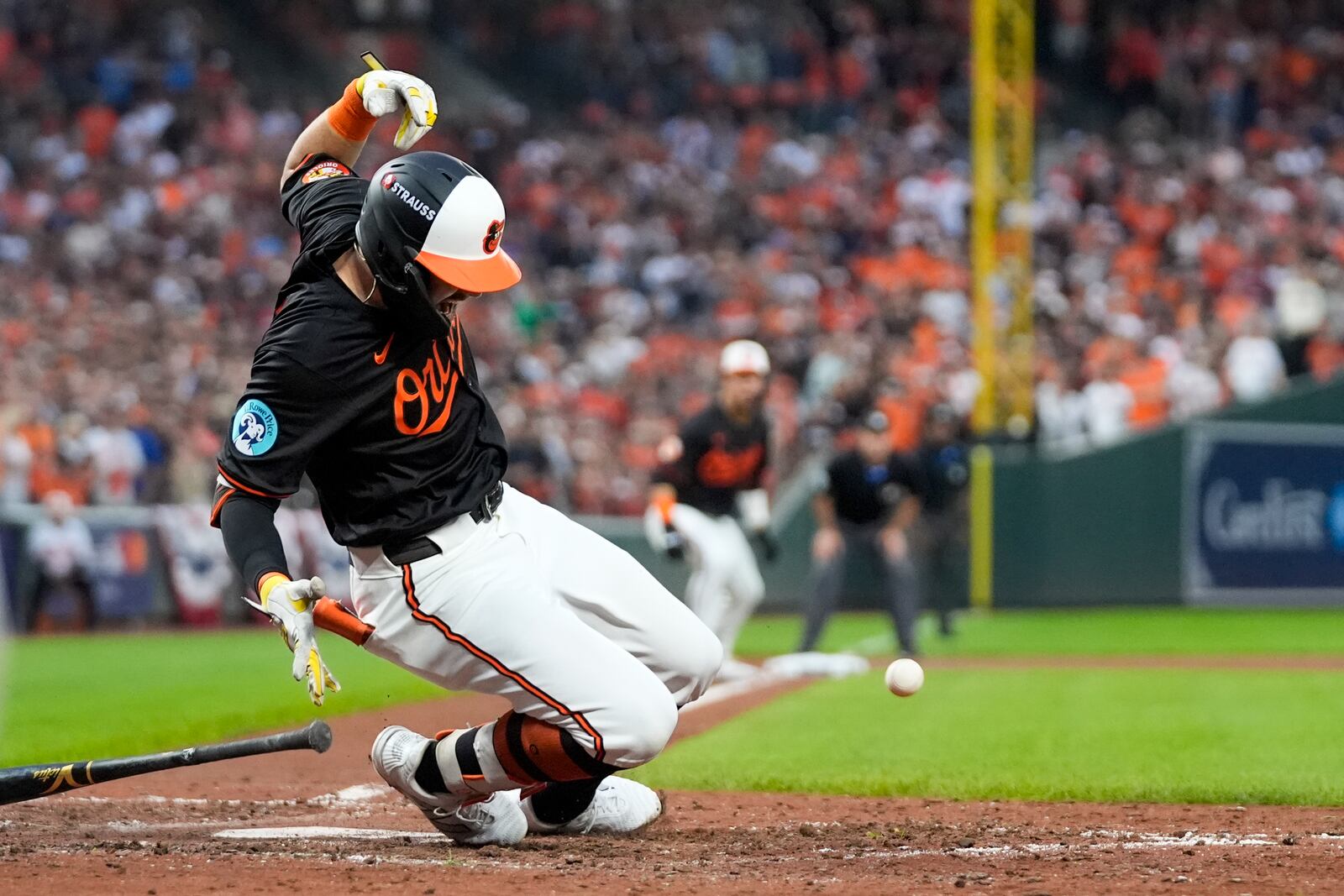 Baltimore Orioles' Colton Cowser reacts after being hit by a pitch from Kansas City Royals pitcher Angel Zerpa during the fifth inning in Game 2 of an AL Wild Card Series baseball game, Wednesday, Oct. 2, 2024 in Baltimore. (AP Photo/Stephanie Scarbrough)