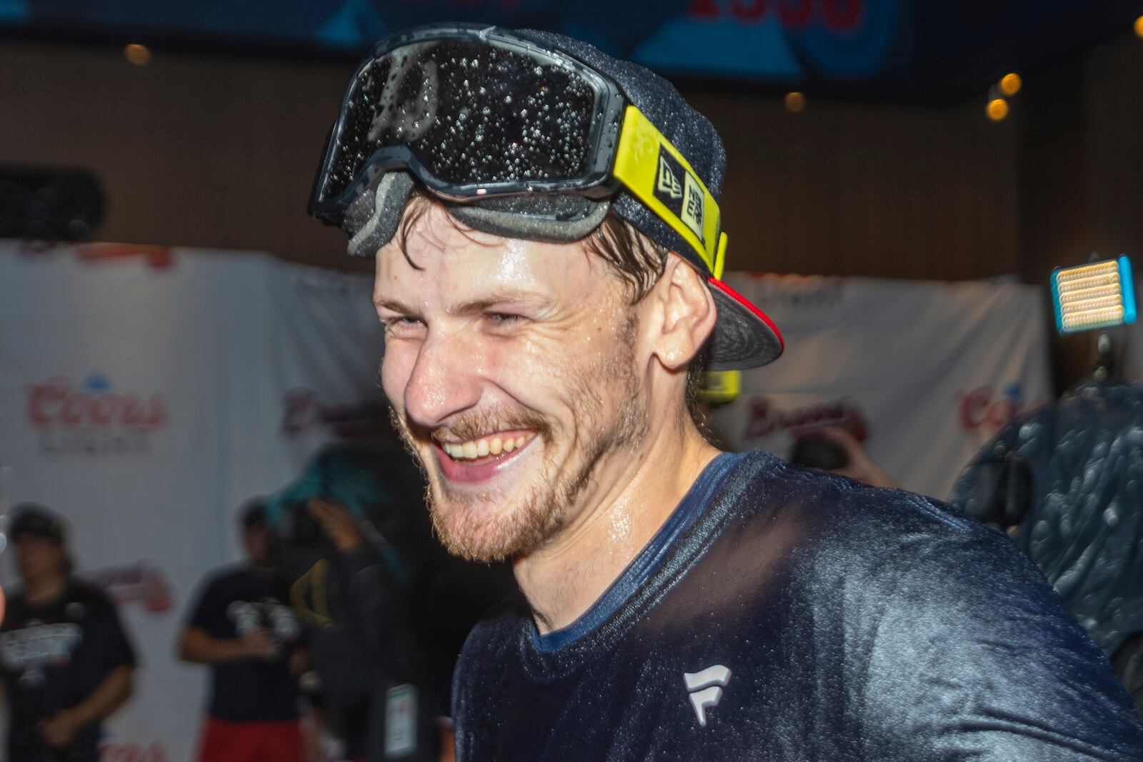 Atlanta Braves catcher Sean Murphy celebrates in the locker room after clinching a wild-card playoff berth after the second baseball game of a doubleheader against the New York Mets, Monday, Sept. 30, 2024, in Atlanta. (AP Photo/Jason Allen)