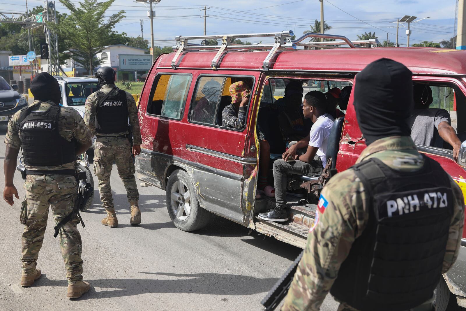 Police officers patrol near the Toussaint Louverture International Airport in Port-au-Prince, Haiti, Tuesday, Nov. 12, 2024. (AP Photo/Odelyn Joseph)