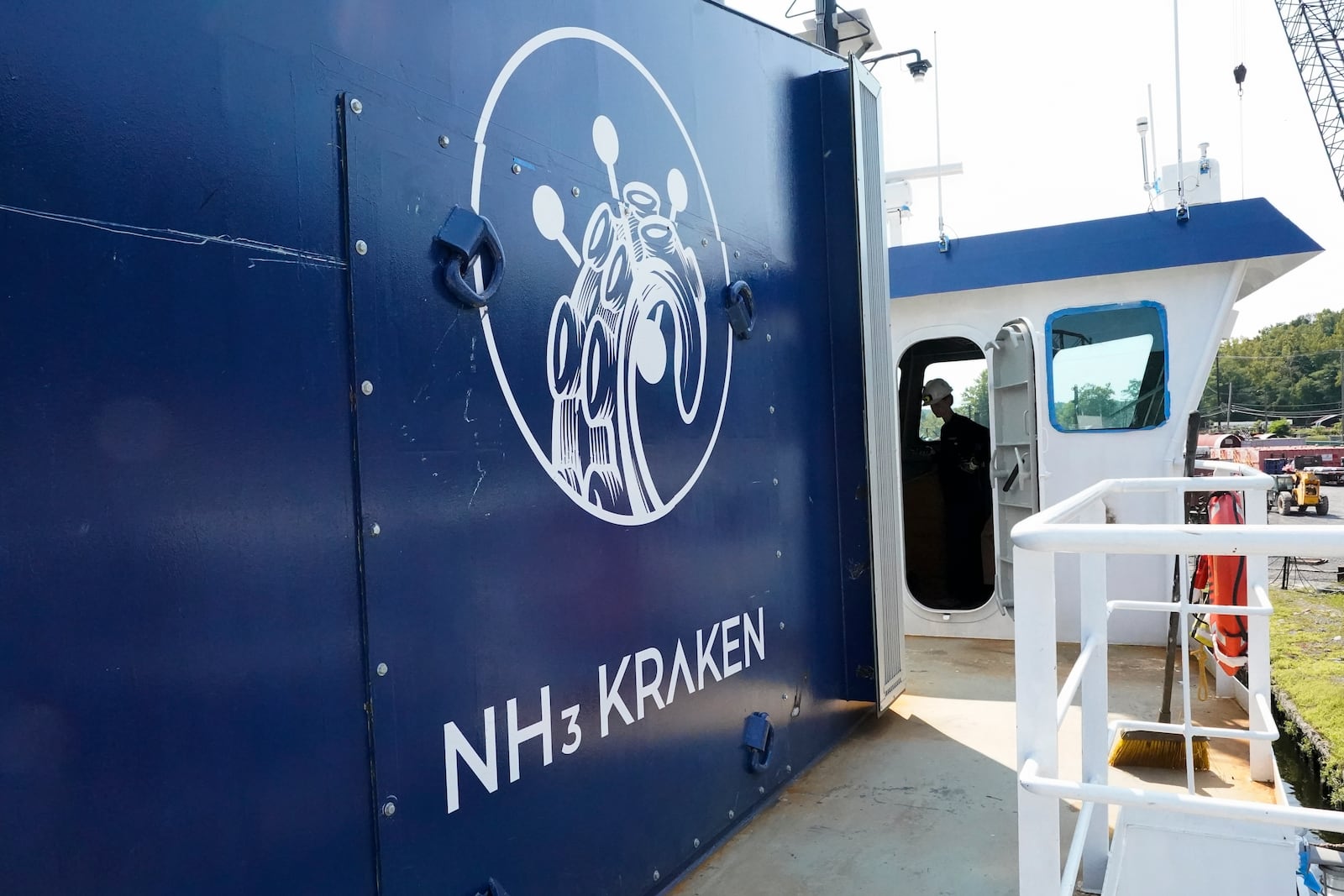 Abigail Jablansky, head of project management, stands in the captain area of the NH3 Kraken, a tugboat powered by ammonia, Friday, Sept. 13, 2024, in Kingston, N.Y. (AP Photo/Alyssa Goodman)