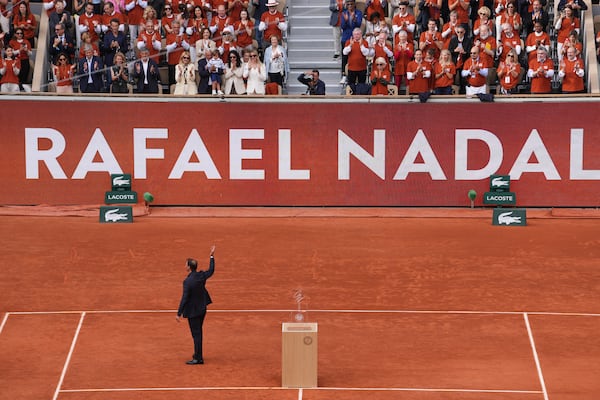 Rafa Nadal waves to the crowd during a farewell ceremony at center court Philippe-Chatrier, at the Roland-Garros stadium, in Paris, Sunday May 25, 2025 (AP Photo/Thibault Camus)