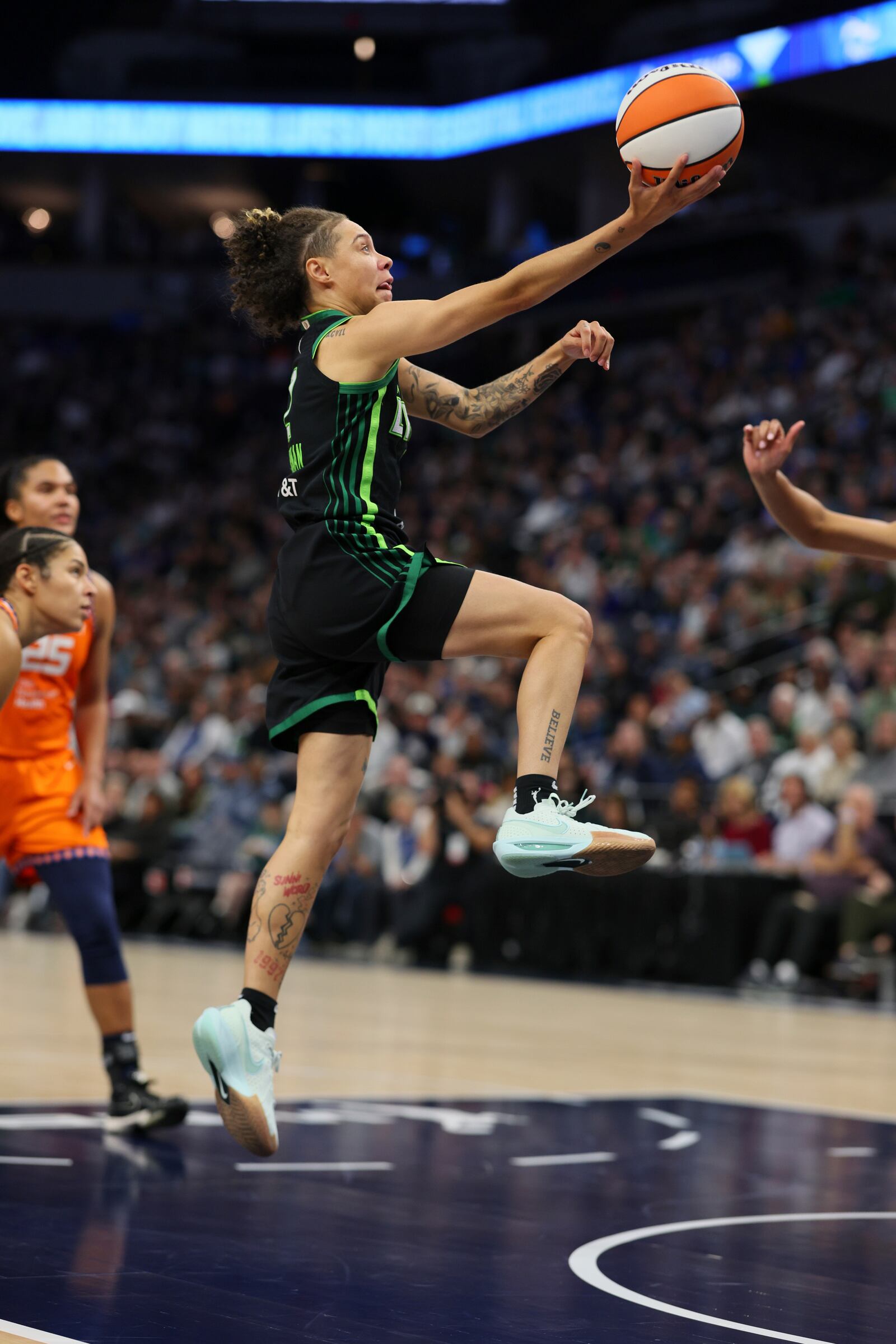 Minnesota Lynx guard Natisha Hiedeman (2) shoots the ball during the second half of Game 2 of a WNBA basketball semifinals game against the Connecticut Sun, Tuesday, Oct. 1, 2024, in Minneapolis. (AP Photo/Adam Bettcher)