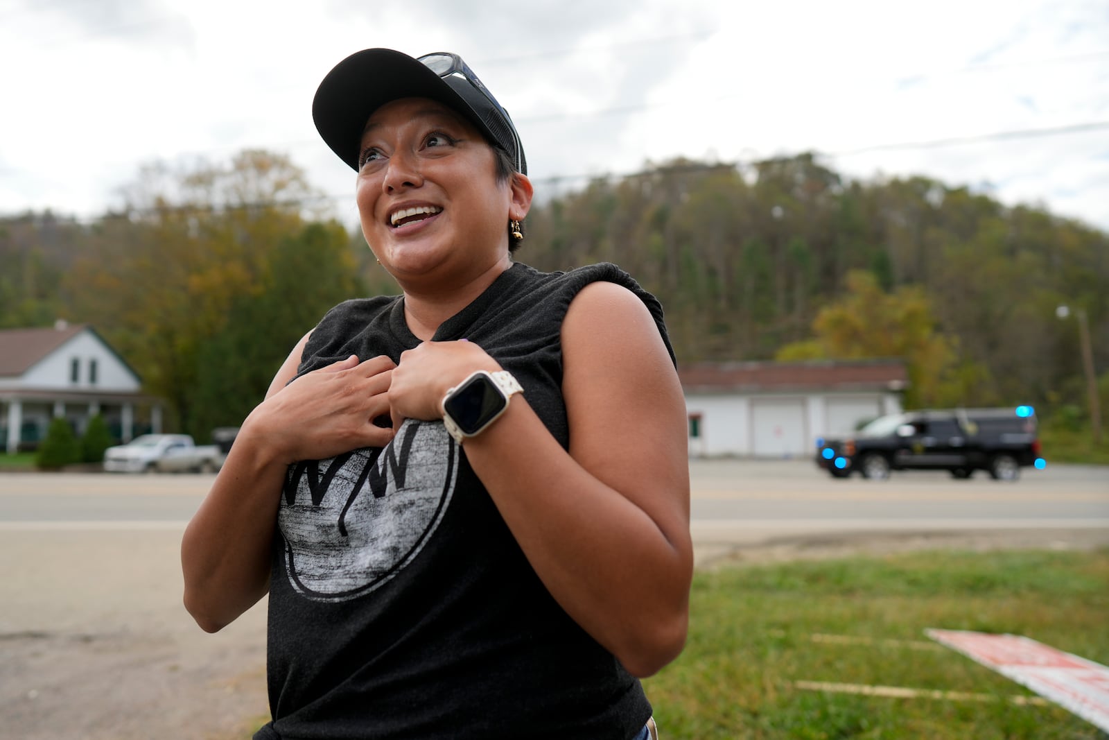 Nancy Crawford talks at distribution center on Thursday, Oct. 3, 2024, in Vilas, N.C. in the aftermath of hurricane Helene. In the final weeks of the presidential election, people in North Carolina and Georgia, influential swing states, are dealing with more immediate concerns: recovering from Hurricane Helene. (AP Photo/Chris Carlson)