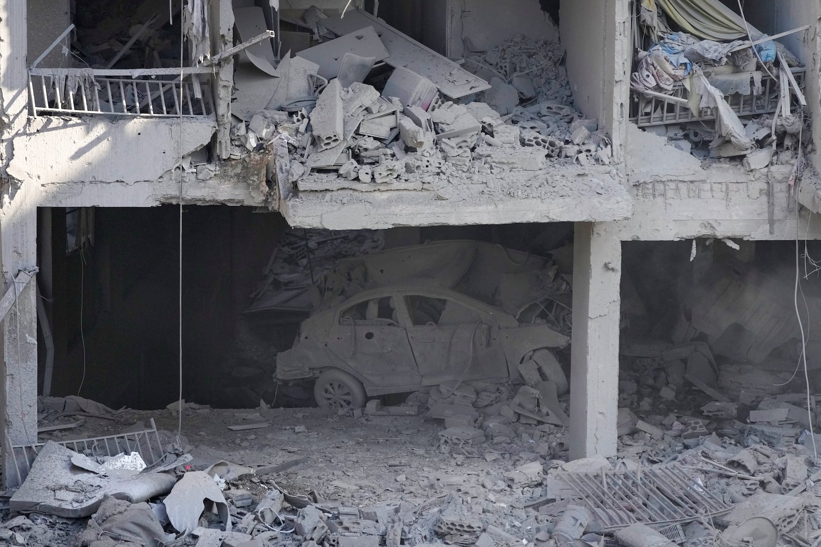 A destroyed building at the site of an Israeli airstrike in Beirut's southern suburbs, Sunday, Sept. 29, 2024. (AP Photo/Hassan Ammar)