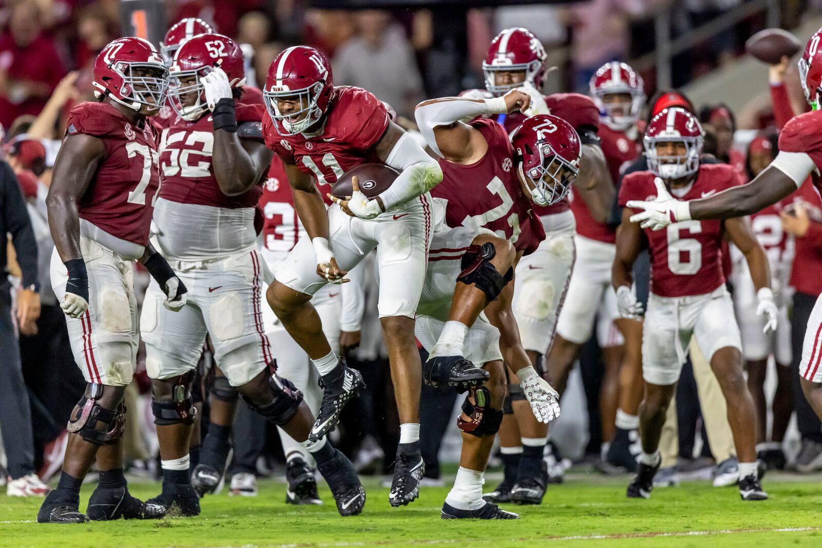 Alabama linebacker Jihaad Campbell and offensive lineman Parker Brailsford celebrates after Campbell's interception during the first half of an NCAA college football game against Georgia, Saturday, Sept. 28, 2024, in Tuscaloosa, Ala. (AP Photo/Vasha Hunt)