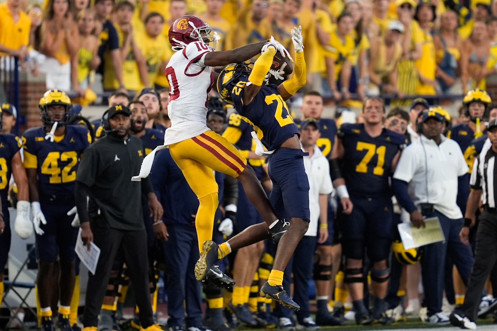 Michigan defensive back Jyaire Hill (20) breaks up a pass intended for Southern California wide receiver Kyron Hudson (10) in the second half of an NCAA college football game in Ann Arbor, Mich., Saturday, Sept. 21, 2024. (AP Photo/Paul Sancya)