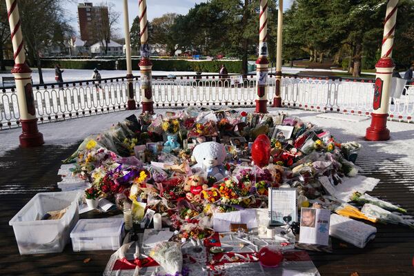 Flowers, portraits and toys lay in the ground for memory of the One Direction star singer Liam Payne at a memorial in West Park in his hometown of Wolverhampton, England, Wednesday, Nov. 20, 2024. (Jacob King/PA via AP)