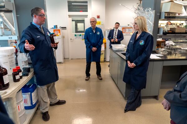 Attorney General Pam Bondi, right, listens as David Guthrie, a senior research chemist with the Drug Enforcement Administration speaks during a tour of a DEA research laboratory on Tuesday, April 29, 2025, in Northern Virginia. (AP Photo/Mark Schiefelbein)