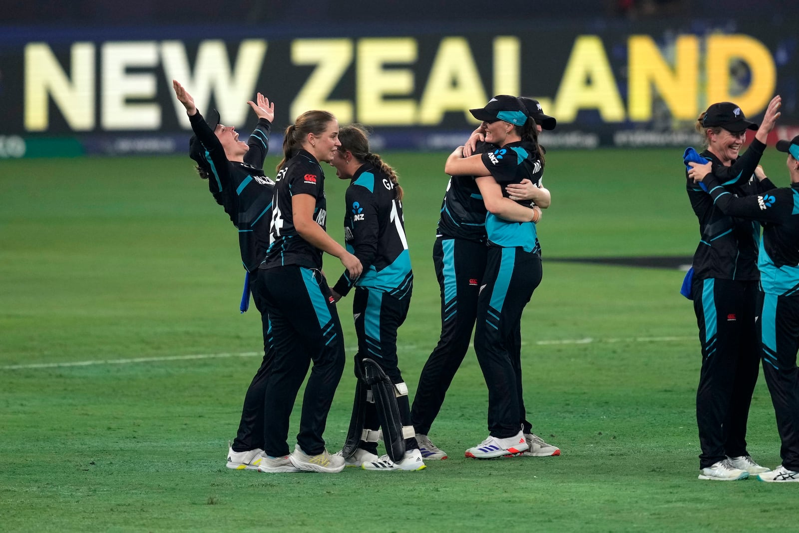 New Zealand's players celebrate after winning the ICC Women's T20 World Cup 2024 final match against South Africa at Dubai, United Arab Emirates, Sunday, Oct. 20, 2024. (AP Photo/Altaf Qadri)