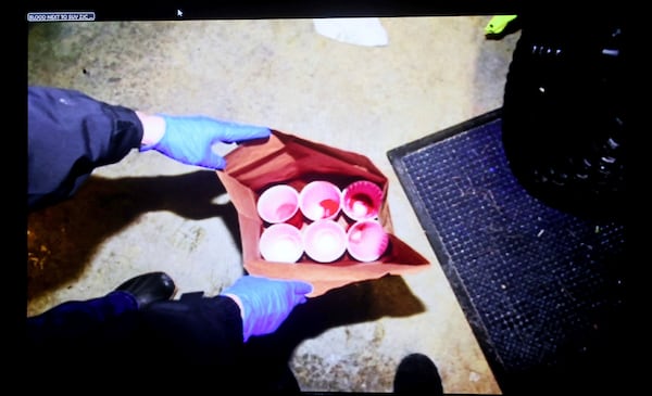 An evidence picture of red Solo cups used by the Canton police to collect blood evidence is displayed during the Karen Read trial, Tuesday, May 6, 2025, in Dedham, Mass. (Matt Stone /The Boston Herald via AP, Pool)