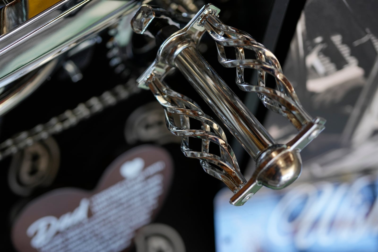 A detail of 7-year-old Daniel Marquez's chrome lowrider bike, built by Daniel and family friends in memory of his late father Alberto, a longtime member of lowrider car clubs, can be seen Saturday, Sept. 14, 2024, at his home in Frankfort, Ill. (AP Photo/Erin Hooley)