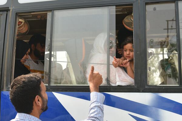 An Indian relative gives thumbs up to a Pakistani family as they leave in a bus at the Attari-Wagah border between India and Pakistan, near Amritsar, India, following New Delhi’s decision to order almost all Pakistani citizens to leave the country after last week’s deadly attack in Indian-controlled Kashmir, Wednesday, April 30, 2025. (AP Photo/Prabhjot Gill)