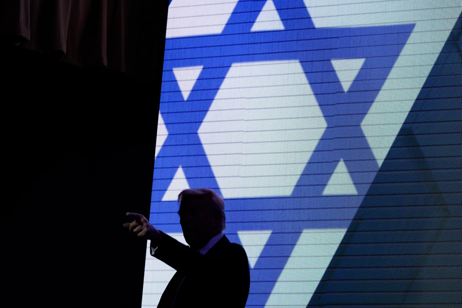 Republican presidential nominee former President Donald Trump acknowledges the crowd as he exits the stage after speaking at the Israeli American Council National Summit, Thursday, Sept. 19, 2024, in Washington. (AP Photo/Evan Vucci)