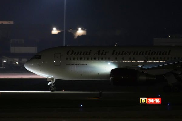 A plane with three American citizens, Mark Swidan, Kai Li and John Leung who were imprisoned for years by China, arrives at Joint Base San Antonio Lackland, in San Antonio, Wednesday, Nov. 27, 2024. (AP Photo/Eric Gay)