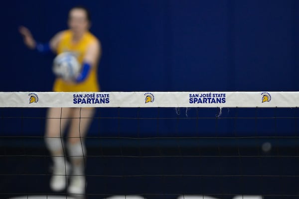 The San Jose State Spartans logo is seen on the net against the Air Force Falcons during the third set of an NCAA college volleyball match Thursday, Oct. 31, 2024, in San Jose, Calif. (AP Photo/Eakin Howard)